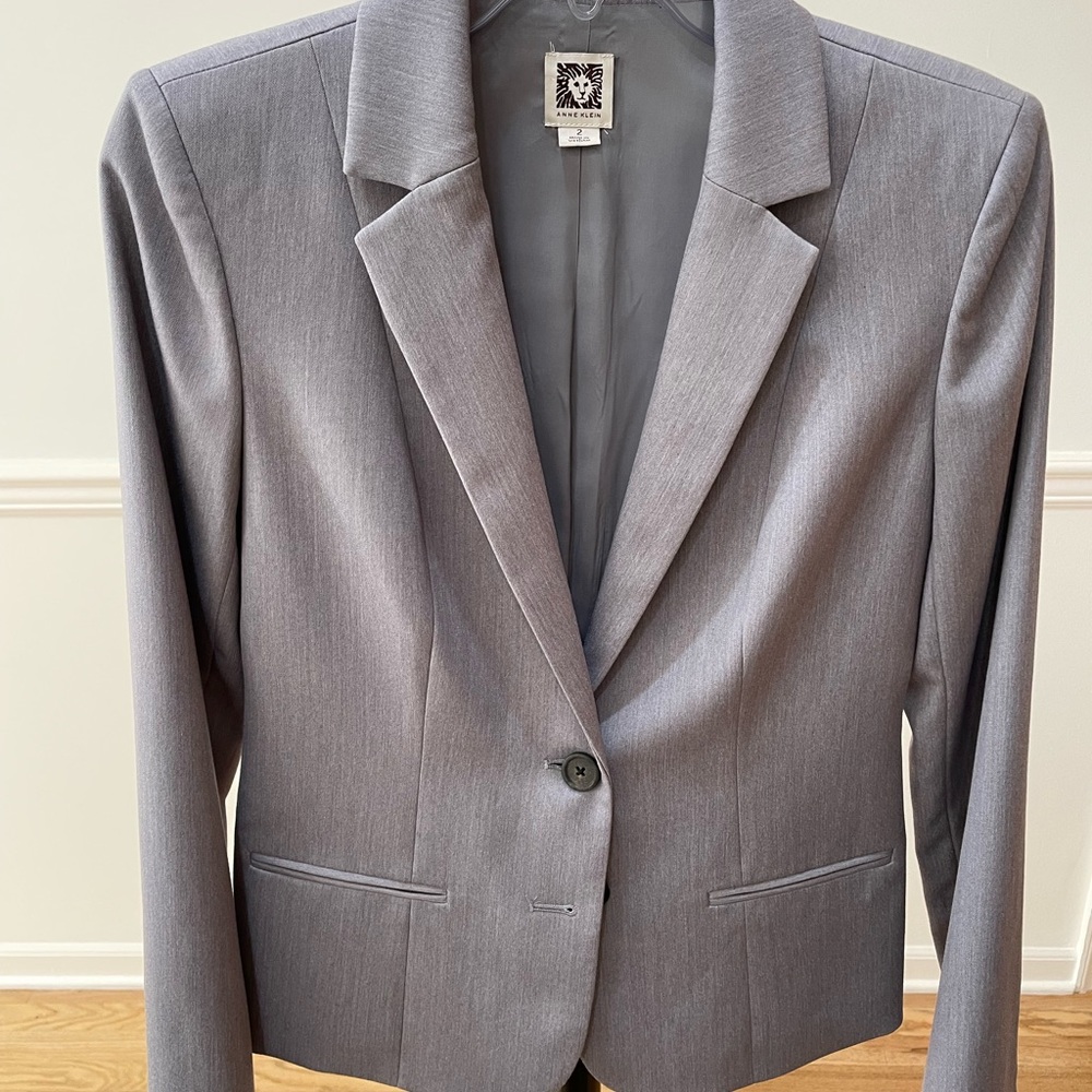 Size 2 grey blazer. Classic styling, looks great with jeans.
